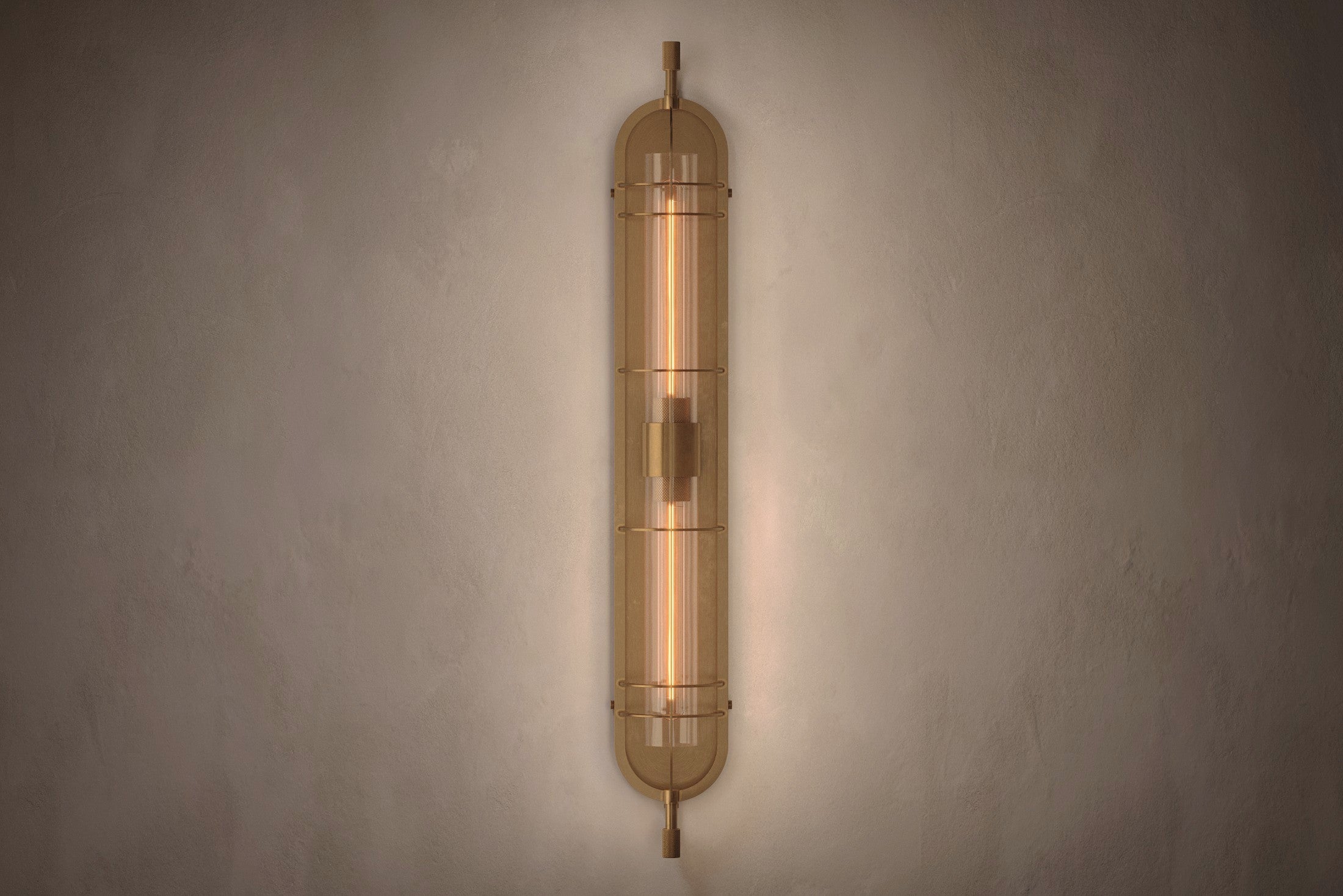 Modern designer lighting featuring the Astragal Sconce, a wall sconce in hand-finished solid brass and glass.