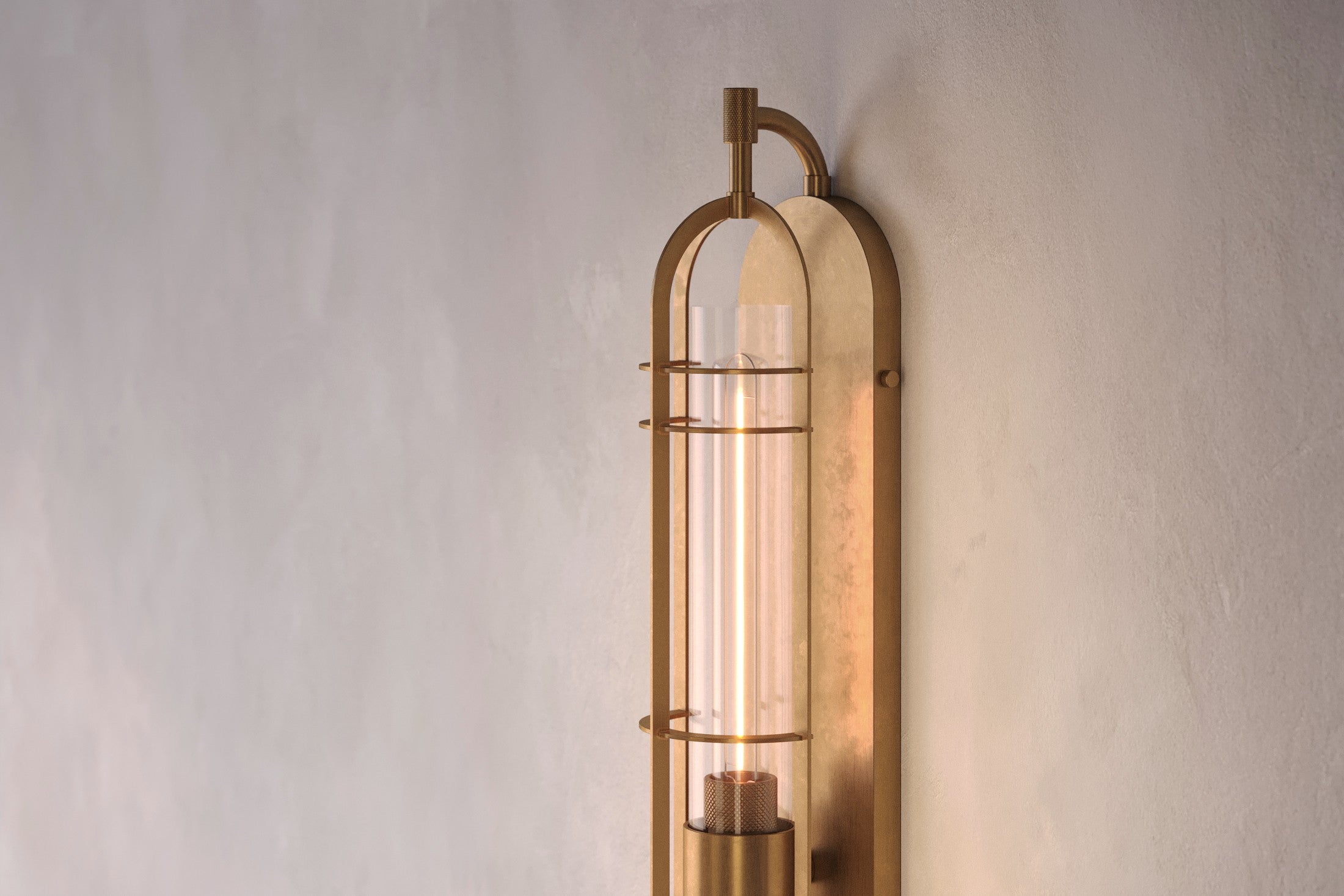 Maritime-inspired designer lighting featuring the Astragal Sconce in hand-finished solid brass and glass.