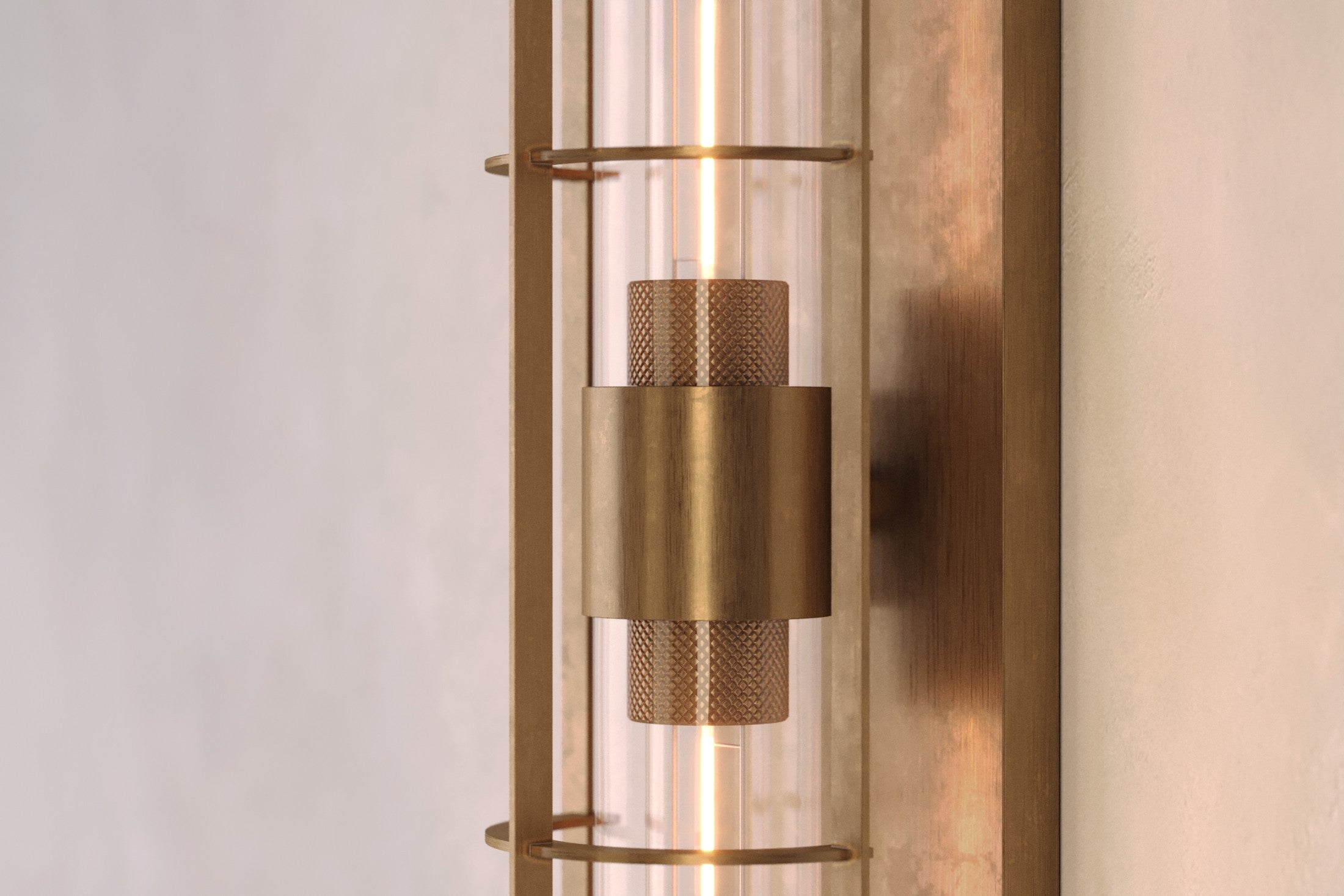 Close-up of the Astragal Sconce, a modern wall sconce featuring hand-finished solid brass and glass.
