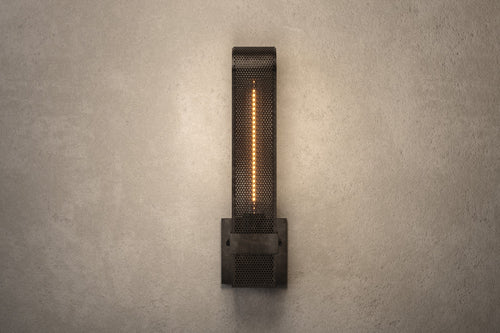 Designer lighting featuring the Baffle Sconce, a modern wall sconce in hand-finished perforated metal.