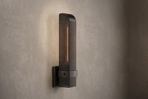 Architectural lighting featuring the Baffle Sconce, a modern wall sconce in hand-finished perforated metal.