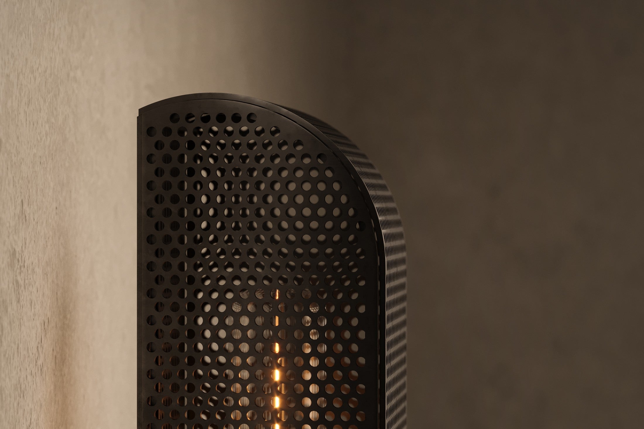 Close-up of the Baffle Sconce, a modern wall sconce featuring hand-finished perforated metal.