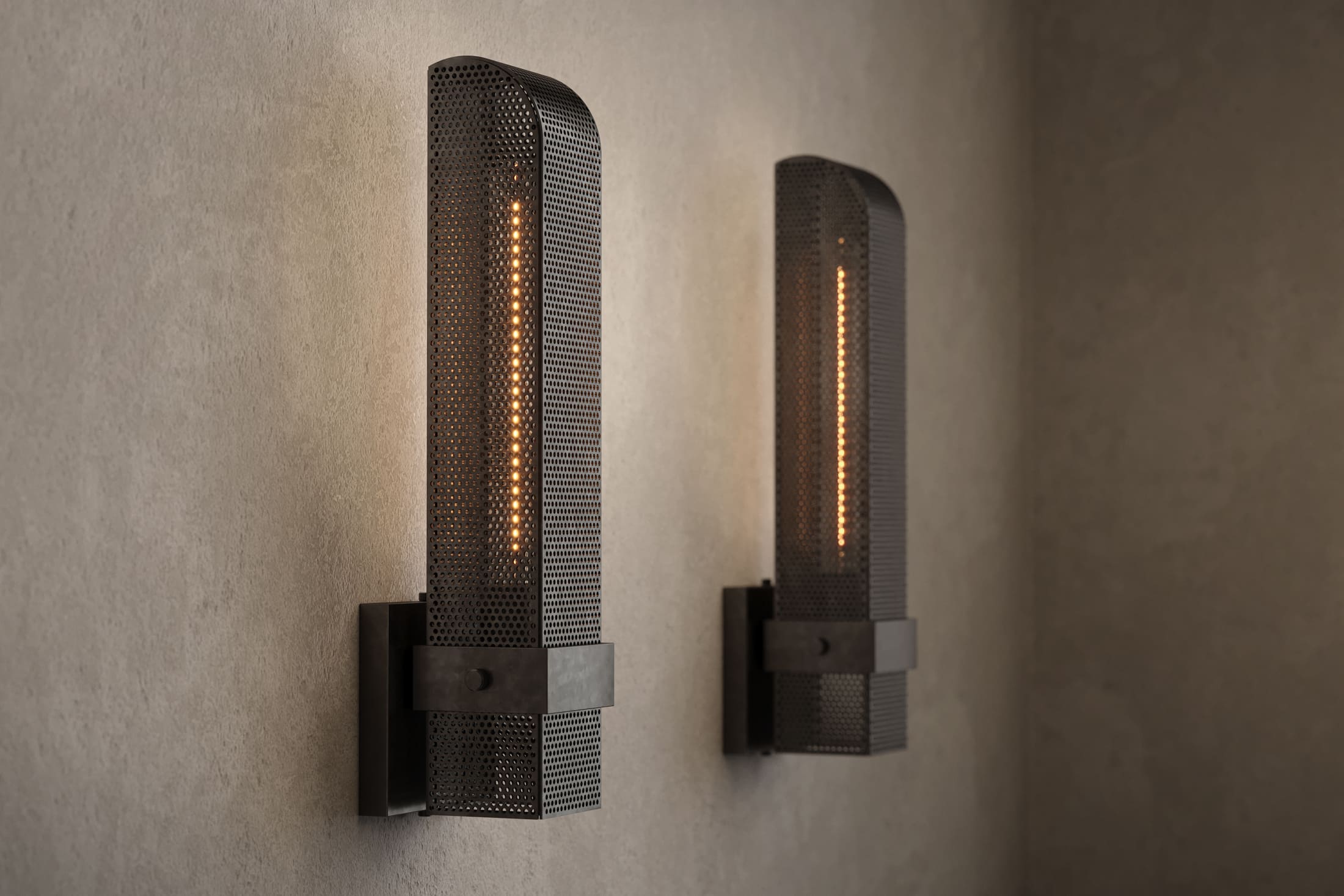 Architectural lighting featuring two Baffle Sconce fixtures in hand-finished perforated metal.