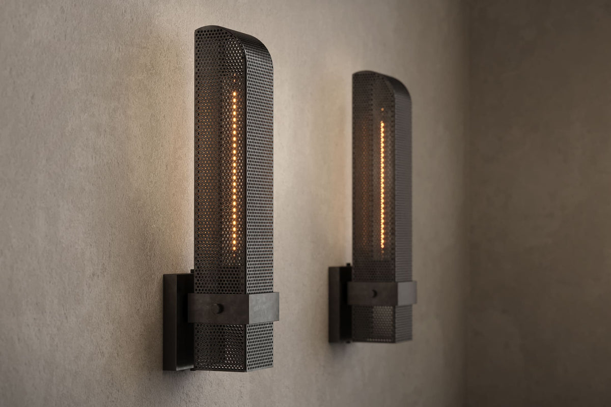 Angled view of pair of designer Baffle Sconces, industrial-inspired wall lights featuring hand-finished perforated steel for genuine, utilitarian elegance.