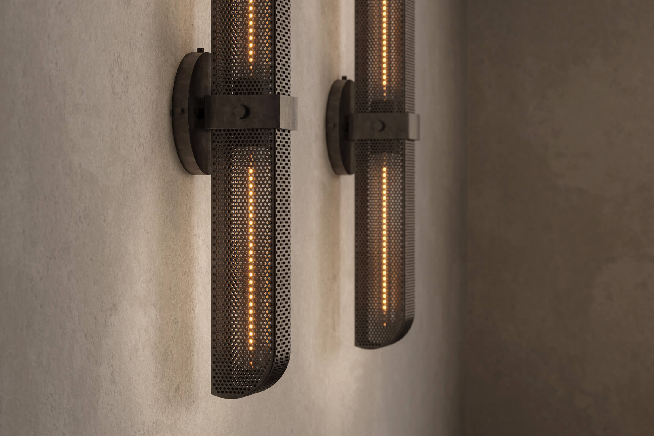 Close-up view of pair of designer Baffle Sconces, industrial-inspired wall lights featuring hand-finished perforated steel for genuine, utilitarian elegance.