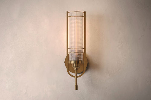 Designer lighting featuring the Batten Sconce, a modern wall sconce in hand-finished solid brass and ribbed glass.