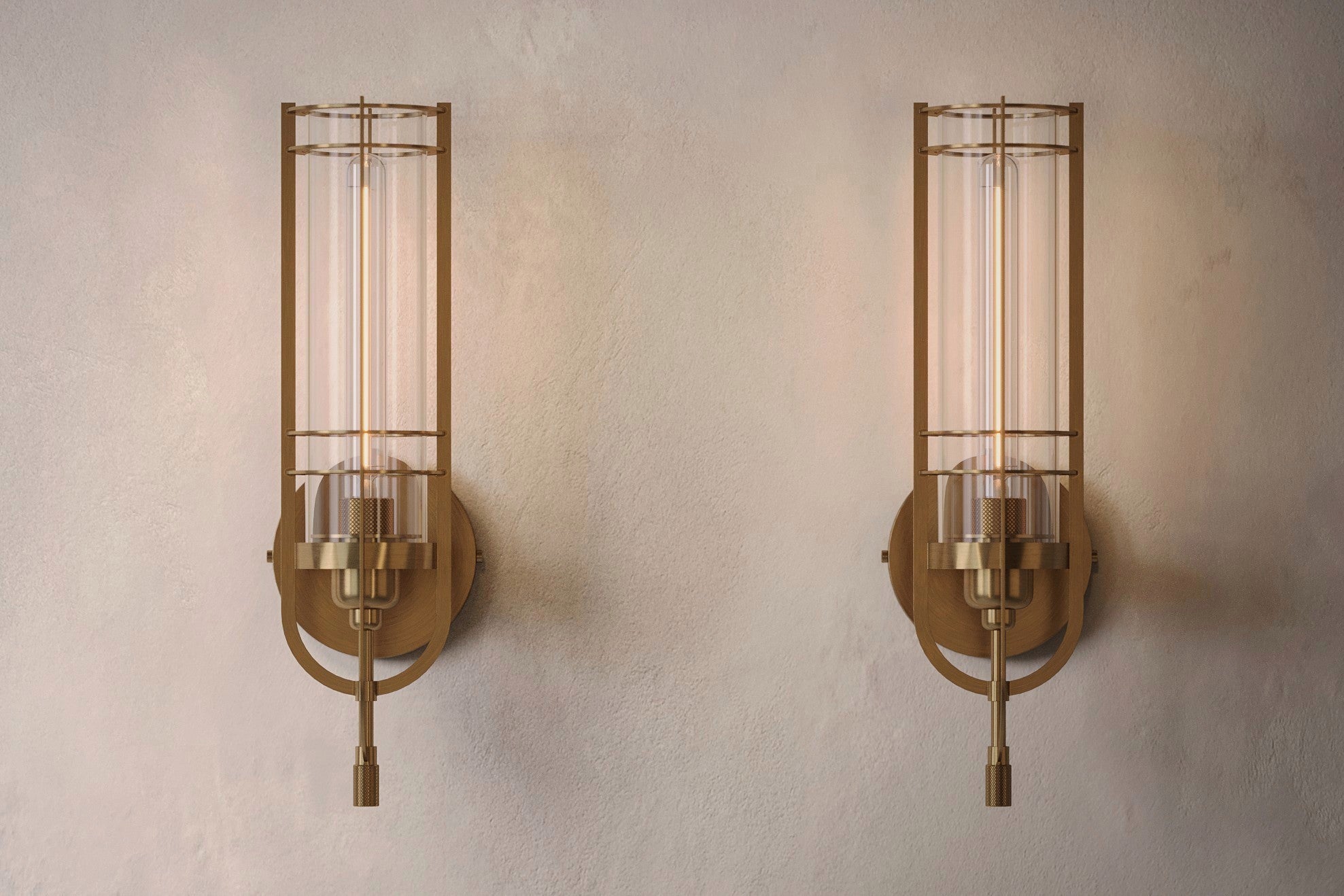 Architectural lighting featuring two Batten Sconce fixtures in hand-finished solid brass and ribbed glass.