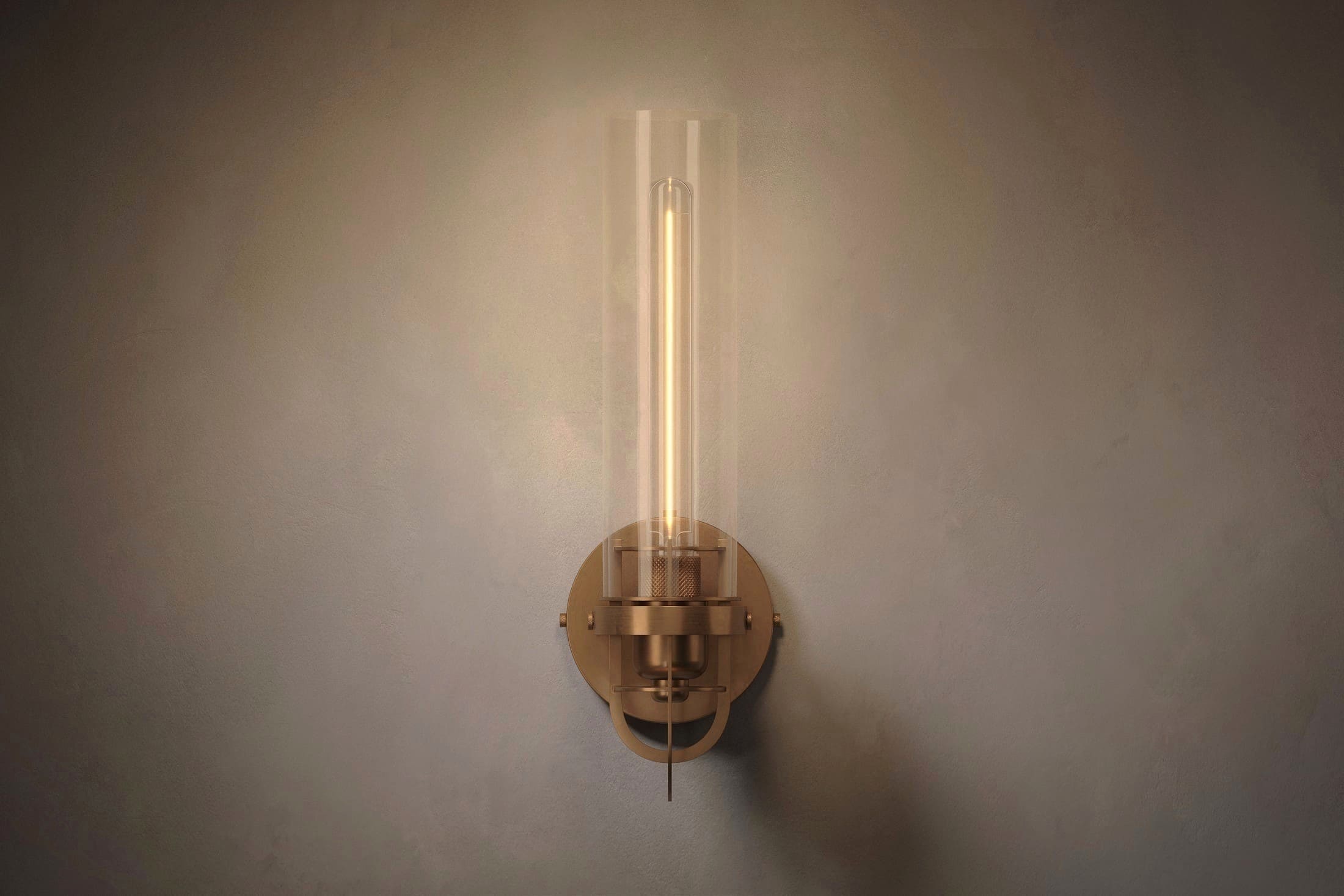 Modern designer lighting featuring the Beacon Sconce, a wall light in hand-finished solid brass and a heavy glass cylinder.