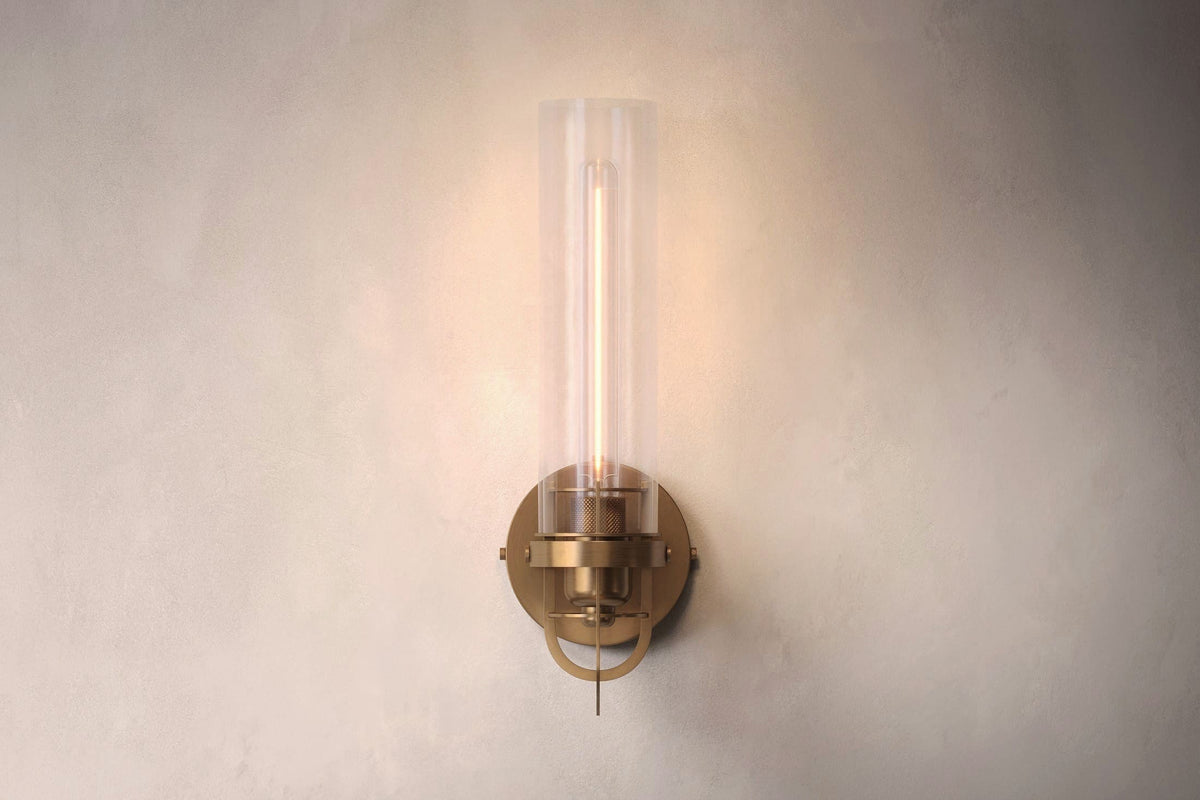 Front view of the designer Beacon Sconce, a nautically-inspired wall light featuring hand-finished solid brass and heavy glass for authentic, artisanal elegance.