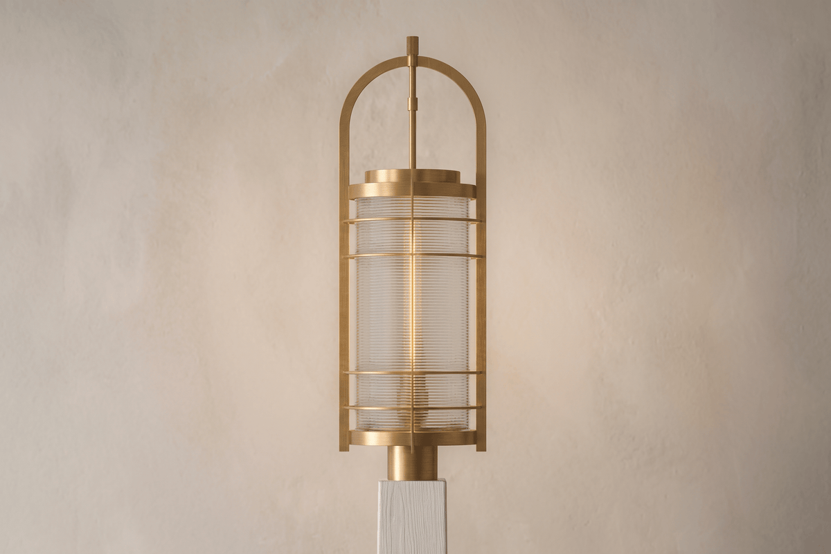Front view of the designer Binnacle Post Lamp, a nautically-inspired outdoor light featuring hand-finished solid brass and heavy glass for authentic, artisanal elegance.