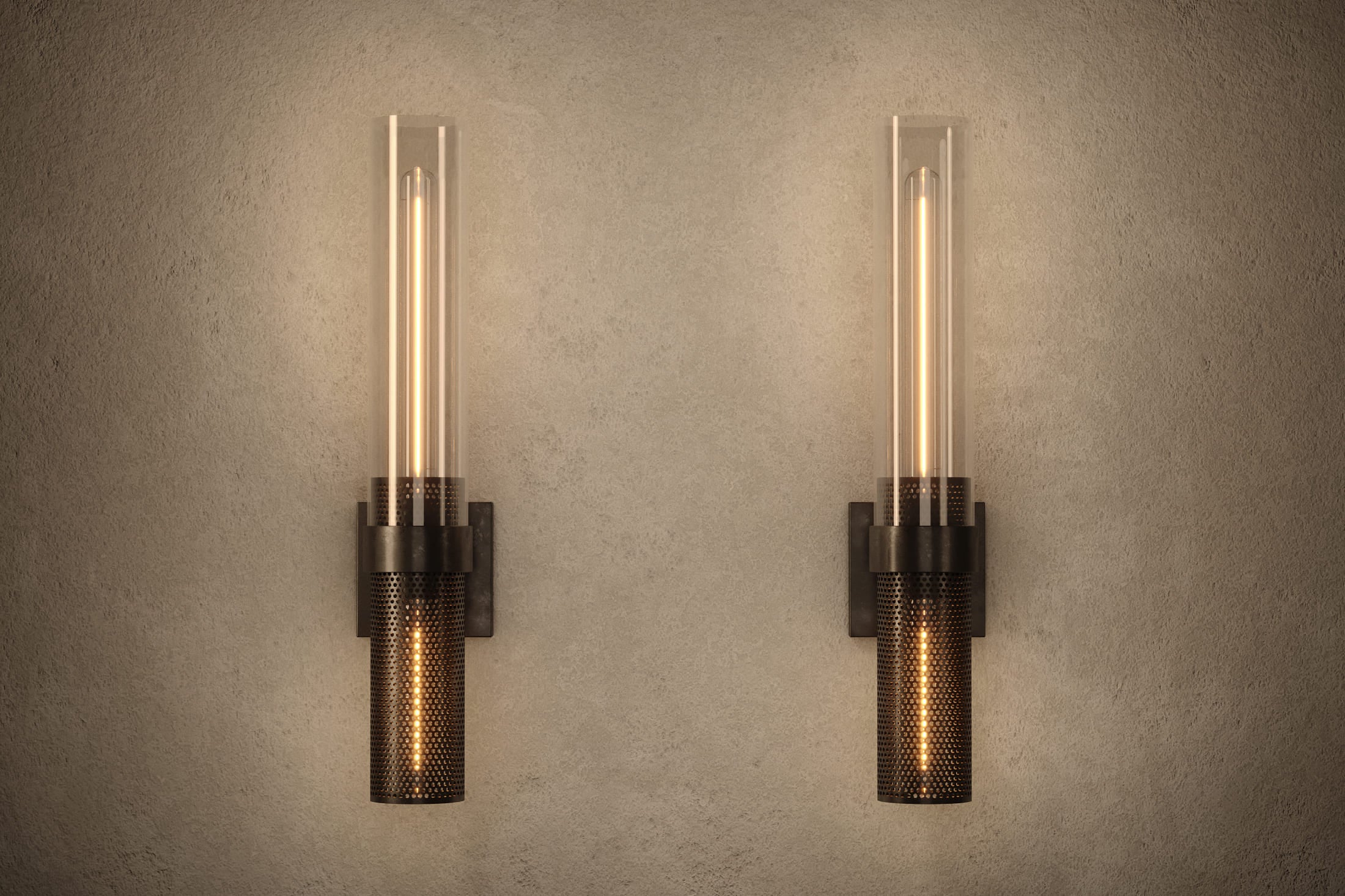 Architectural lighting featuring two Carbide Sconce fixtures in hand-finished perforated metal and glass.