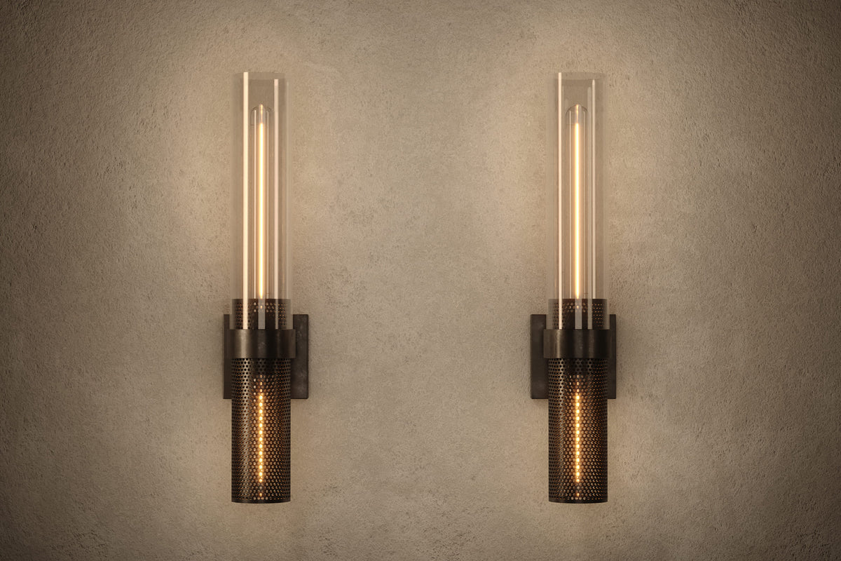 Front view of pair of architectural designer Carbide Sconces, industrial-inspired wall lights featuring hand-finished perforated steel and heavy glass for genuine, utilitarian elegance.