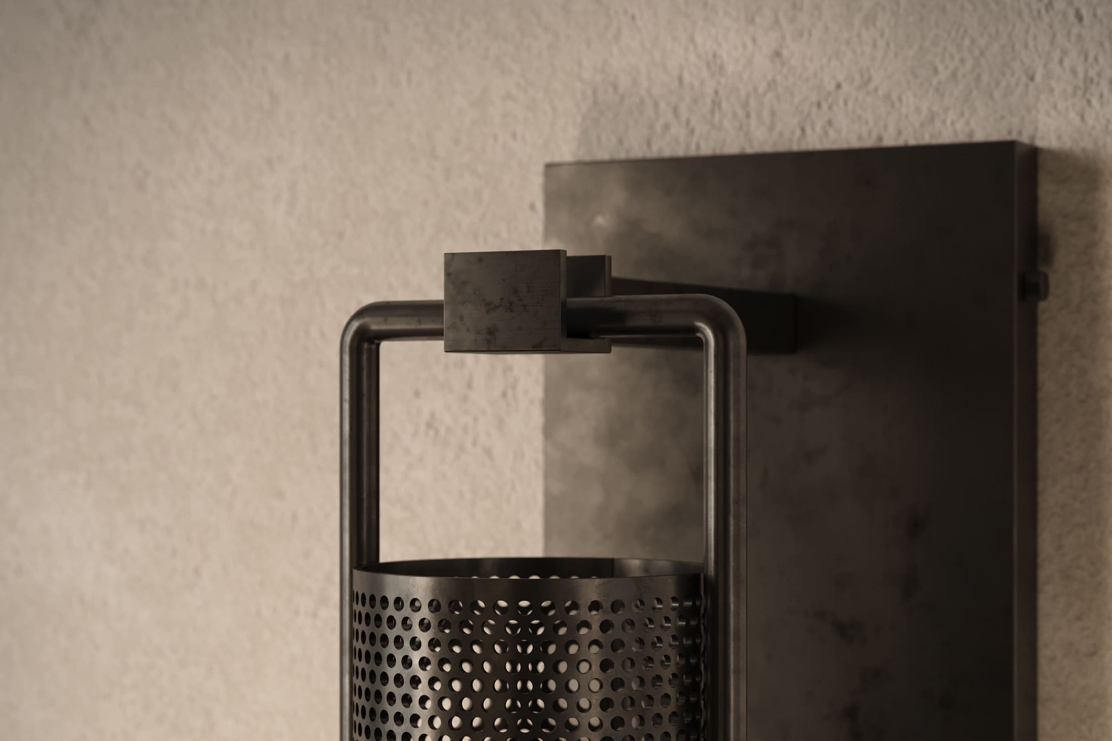 Close-up of the Davy Sconce, a modern wall sconce featuring hand-finished steel and glass.