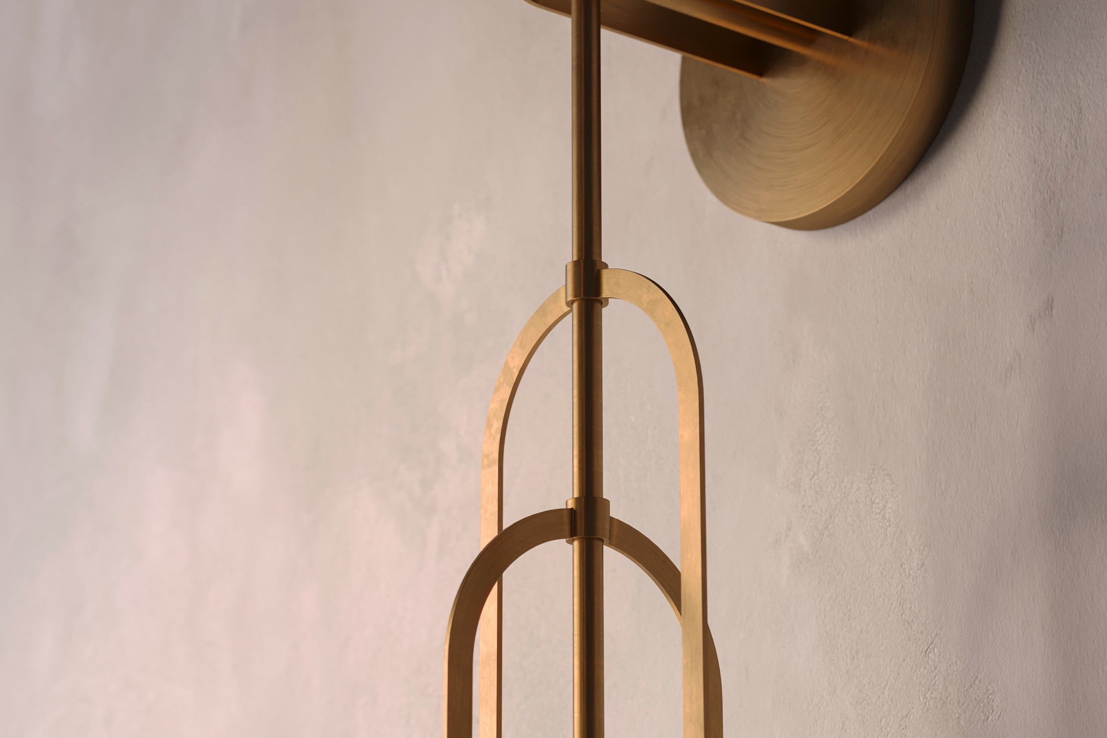 Close-up of the Halyard Axial Sconce, a modern wall sconce featuring hand-finished solid brass and glass.