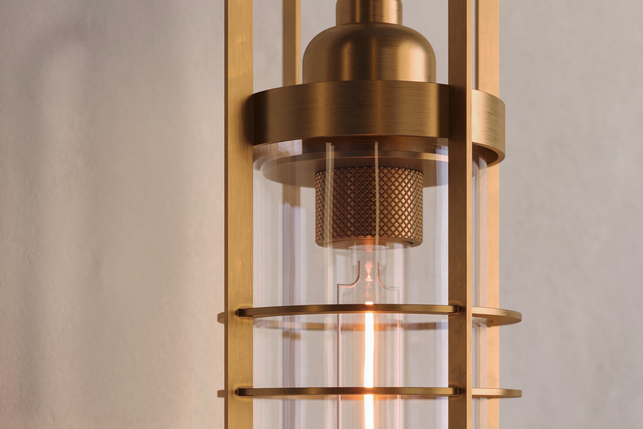 Close-up of the Halyard Axial Sconce, a modern wall sconce featuring hand-finished solid brass and glass.