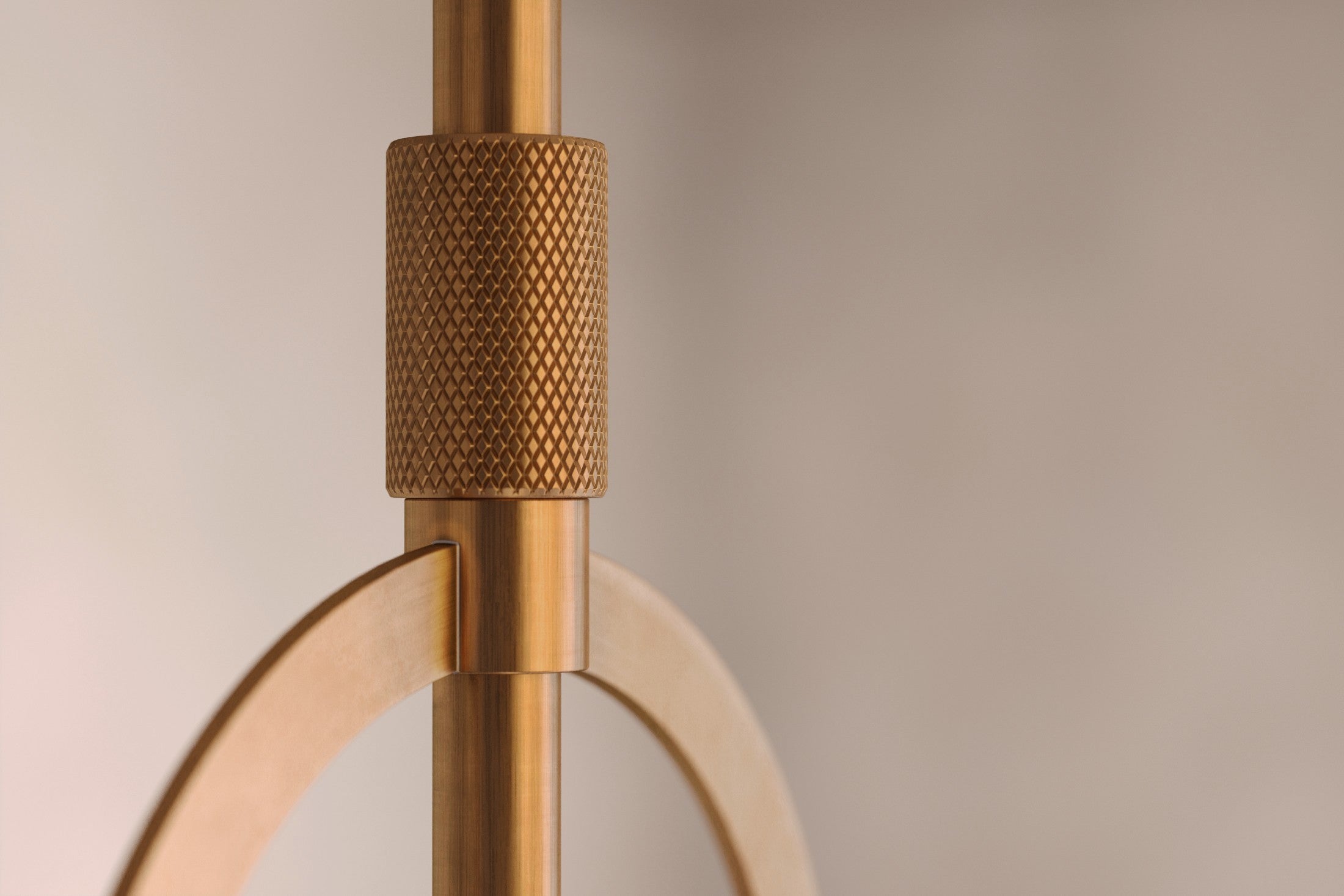 Close-up of the Halyard Pendant, a modern pendant light featuring hand-finished solid brass and glass.