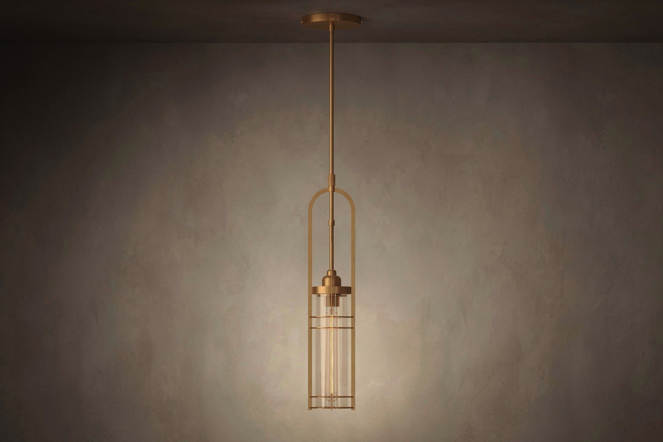 Modern designer lighting featuring the Halyard Pendant, a pendant light in hand-finished solid brass and glass.