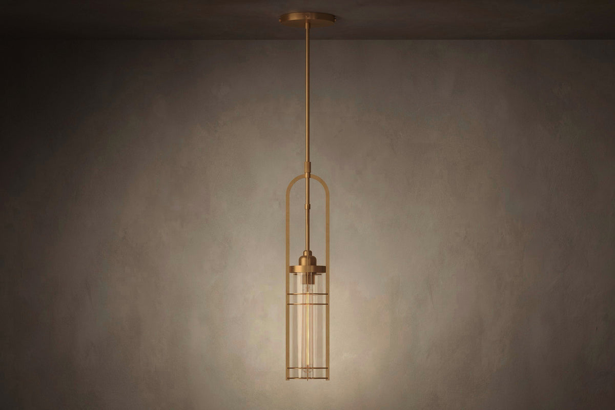 Front view of the architectural designer Halyard Pendant, a nautically-inspired pendant light featuring hand-finished solid brass and heavy glass for authentic, artisanal elegance.