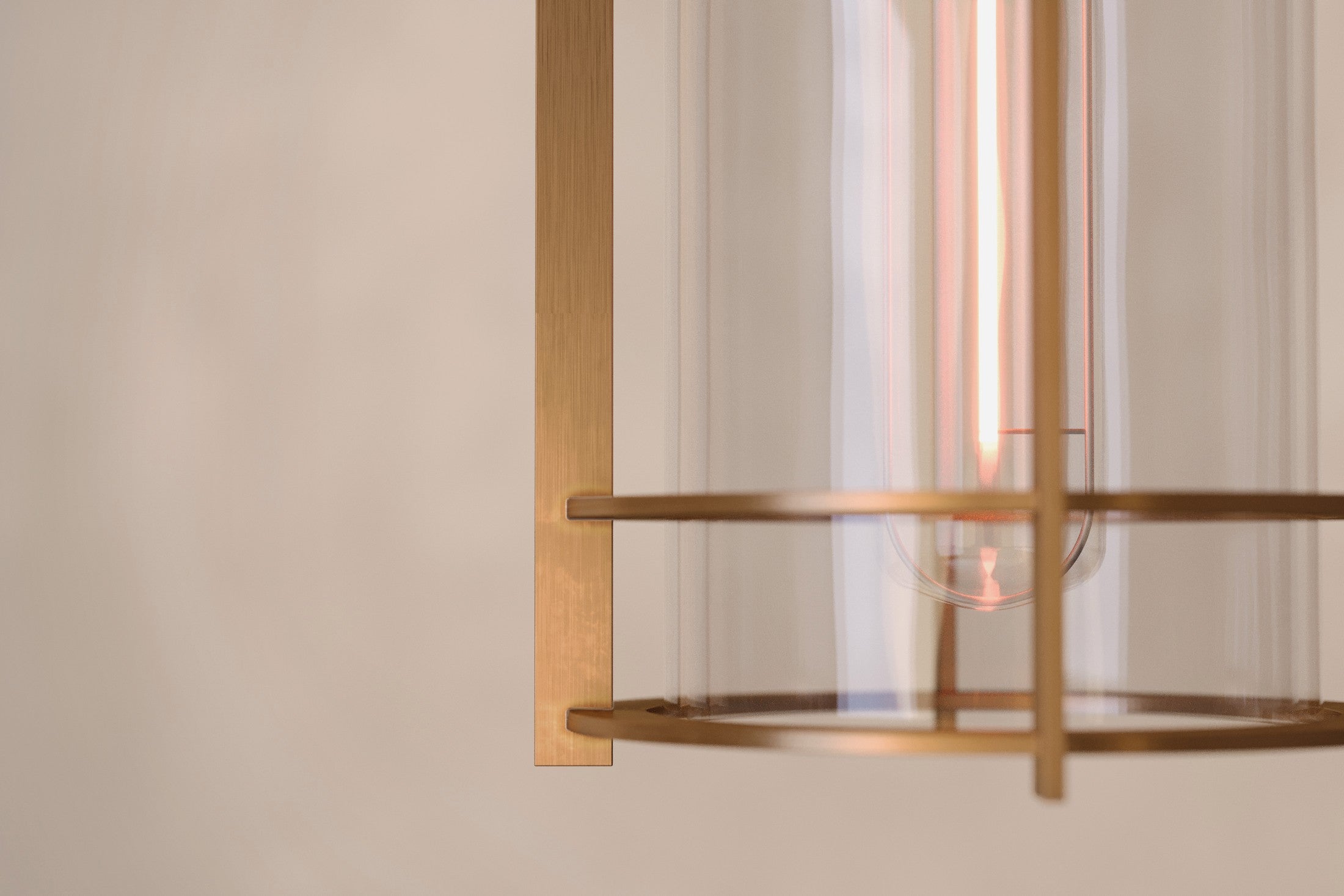 Close-up of the Halyard Pendant, a modern pendant light featuring hand-finished solid brass and glass.