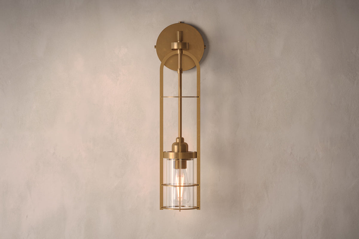 Front view of the designer Halyard Sconce (Aura), a nautically-inspired wall light featuring hand-finished solid brass and heavy glass for authentic, artisanal elegance.