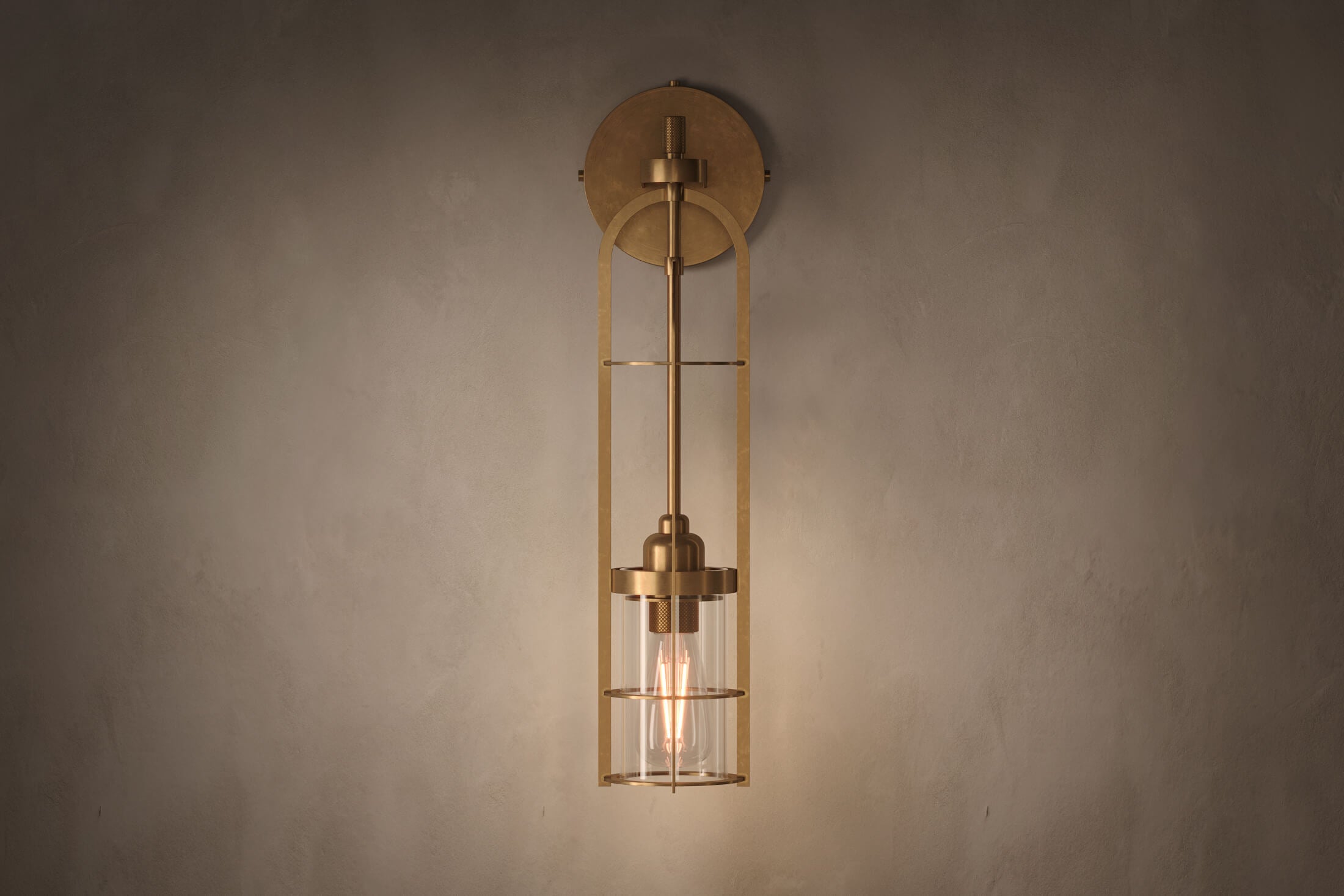 Front view of the architectural designer Halyard Sconce (Aura), a nautically-inspired wall light featuring hand-finished solid brass and heavy glass for authentic, artisanal elegance.