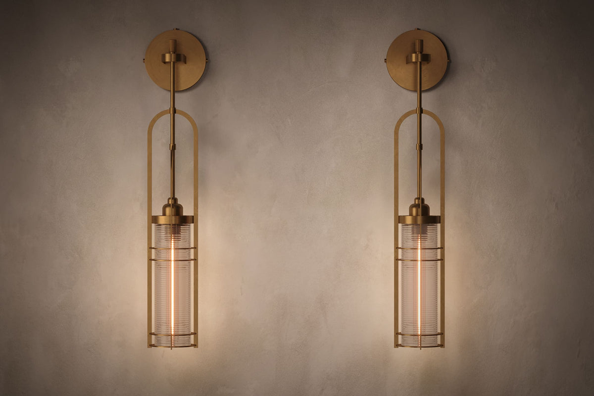 Front view of pair of architectural designer Halyard Sconces, nautically-inspired wall lights featuring hand-finished solid brass and heavy glass for authentic, artisanal elegance.