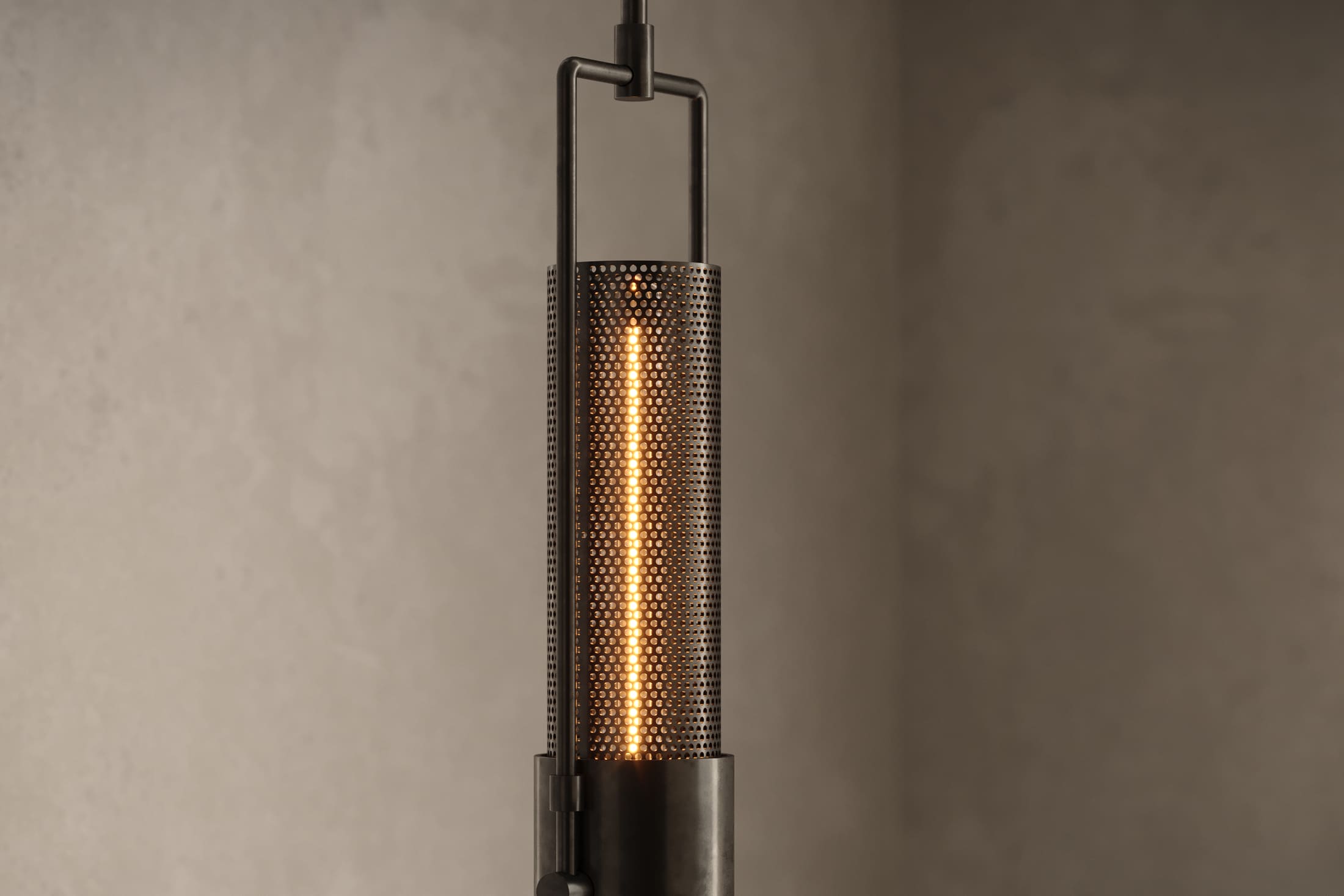 Close-up of the Plumb Pendant, a modern pendant light featuring hand-finished steel and glass.
