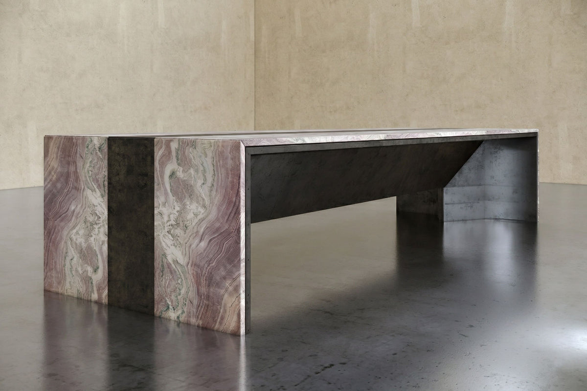 Quartzite and patinated steel bench with a cantilevered top.