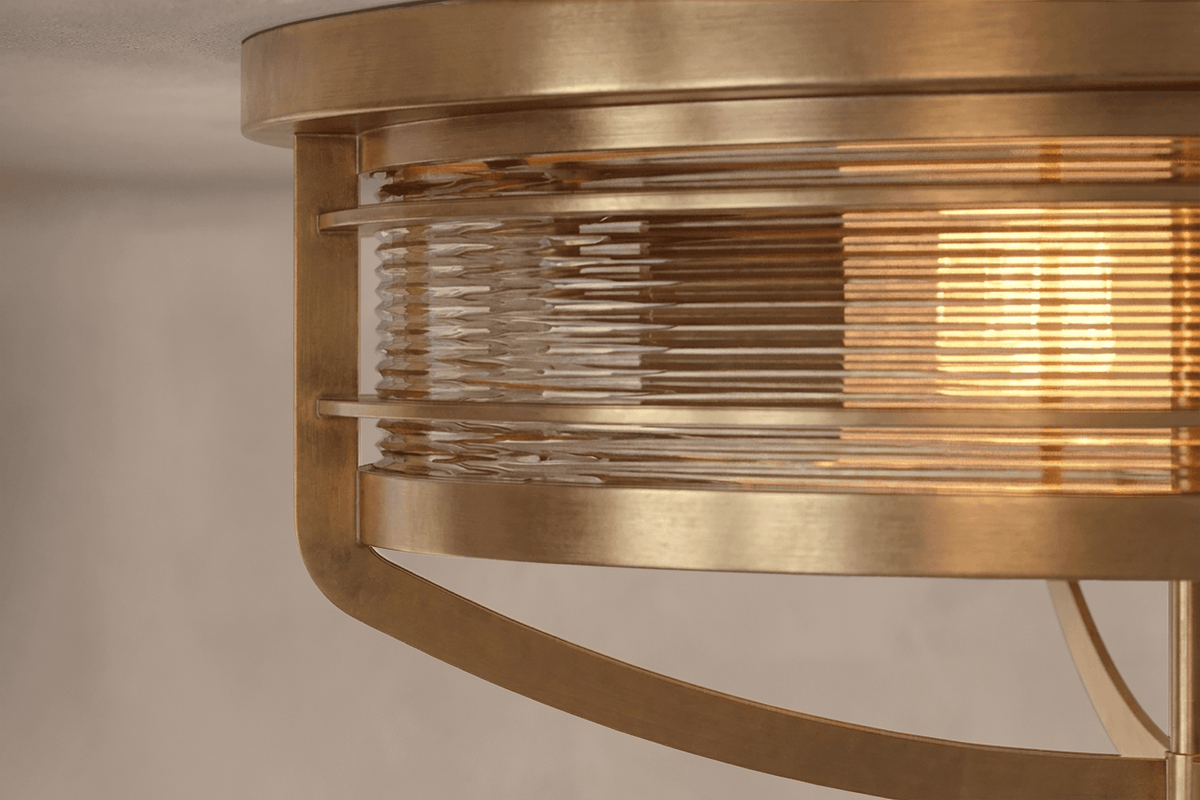 Close-Up view of the designer Zenith Flush Mount, a nautically-inspired ceiling light featuring hand-finished solid brass and heavy glass for authentic, artisanal elegance.